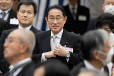 Japanese Prime Minister Fumio Kishida
(center) attends a spring garden party on April 23, 2024, at the
Akasaka Palace imperial garden in Tokyo. Kishida’s approval
rating is close to a record low, a recent survey show has shown.