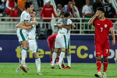 Iraq's players celebrate after winning the U23 AFC Qatar 2024 Asian Cup third-place match against Indonesia at Abdullah Bin Khalifa Stadium in Doha on May 2, 2024.