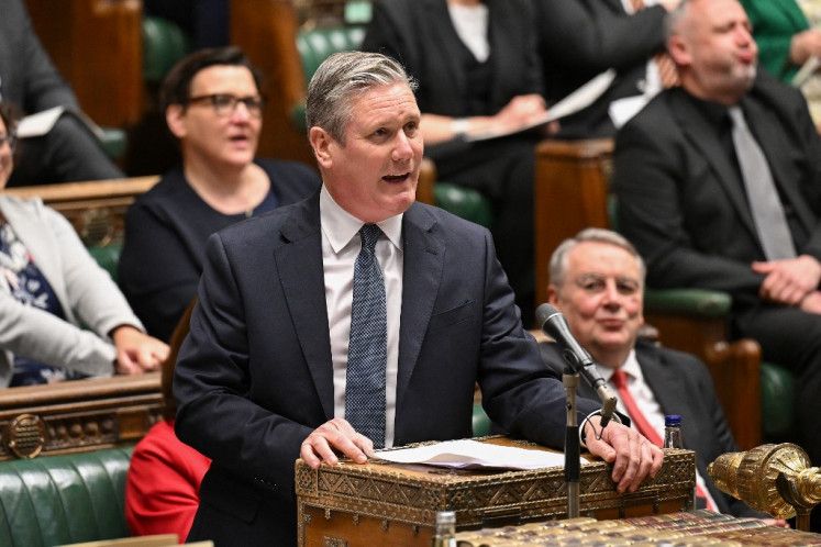 A handout photograph released by the UK Parliament shows Britain's main opposition Labour Party leader Keir Starmer speaking during the weekly session of Prime Minister's Questions (PMQs) in the House of Commons, in central London, on May 1, 2024. 