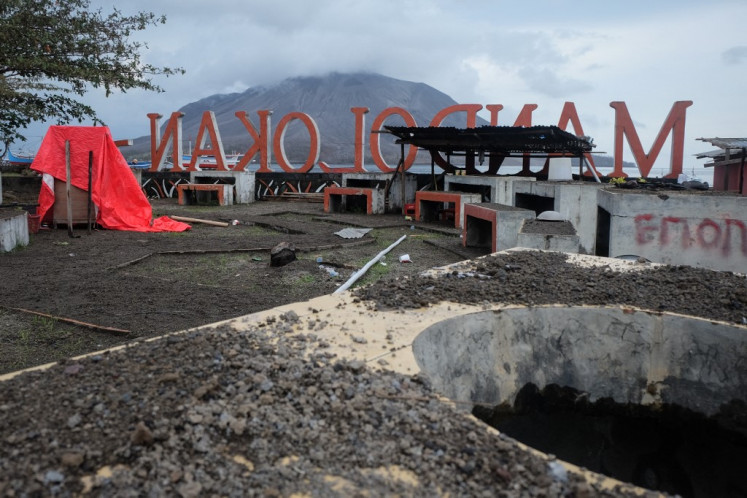 Ash from the eruption of Mount Ruang volcano is seen on the ground on Tagulandang Island in Sitaro, North Sulawesi on May 2, 2024. Eruptions at a remote volcano forced more than half a dozen airports to close with ash spreading as far as Malaysia, officials said on May 1, while authorities rushed to evacuate thousands due to tsunami fears.