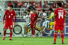 Iraqi forward Ali Jasim runs behind the net as he celebrates after scoring his team's second goal during the Under 23 (U-23) AFC Qatar 2024 Asian Cup third-place match between Iraq and Indonesia at Abdullah Bin Khalifa Stadium in Doha on May 2, 2024.