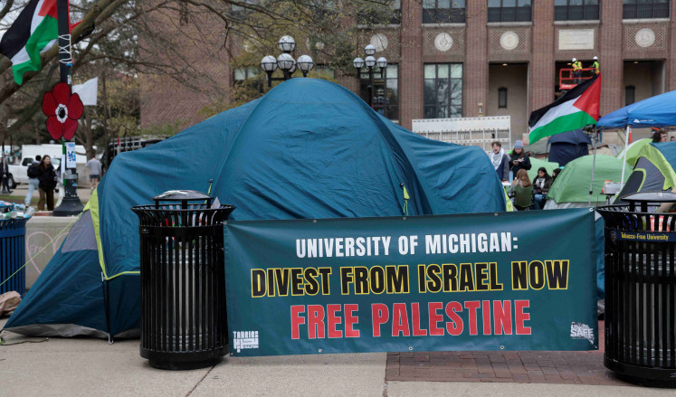 A coalition of University of Michigan students camp in the Diag to pressure the university to divest its endowment from companies that support Israel or could profit from the ongoing conflict between Israel and the Palestinian Islamist group Hamas, on the University of Michigan college campus in Ann Arbor, Michigan, US, April 23, 2024. 