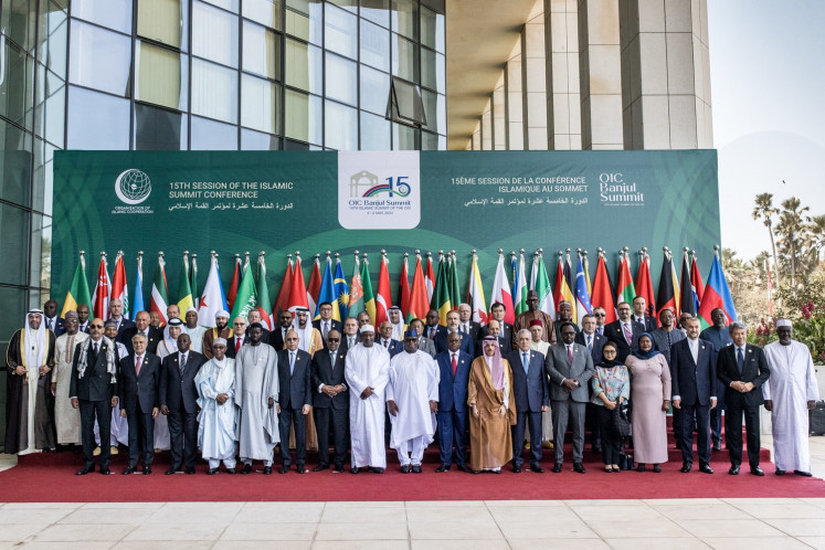 President of The Gambia Adama Barrow (center) stands with other heads of member states and delegation representatives for a family photo on May 04, 2024, during the opening of the Organization of Islamic Cooperation (OIC) 2024 Summit at the Sir Dawda Kairaba Jawara International Conference Center in Banjul.