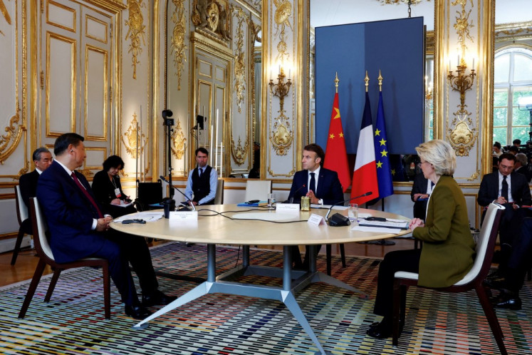 (From left) Chinese President Xi Jinping, France's President Emmanuel Macron, and European Commission President Ursula von der Leyen hold a trilateral meeting as part of the Chinese president's two-day state visit, at the Elysee Palace in Paris, on May 6, 2024. 