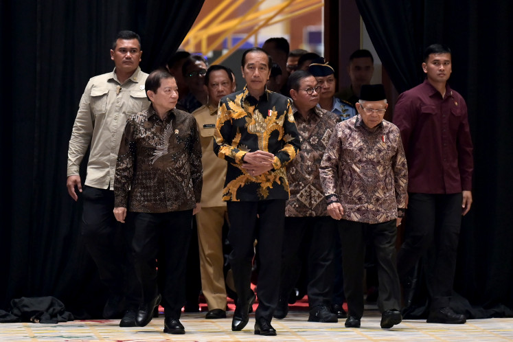 President Joko “Jokowi” Widodo (center) arrives at the Jakarta Convention Center in Central Jakarta on May 6, 2024, where he will open the National Development Planning Conference (Musrenbangnas).
