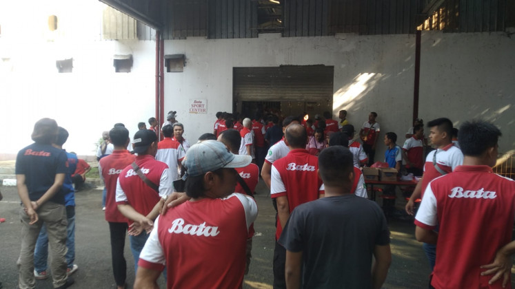 PT Sepatu Bata employees gather for an announcement by the management at the shoe manufacturer's factory in Purwakarta, West Java, on May 3. Most of the workers plan to start their own businesses after being laid off due to the factory's closure.