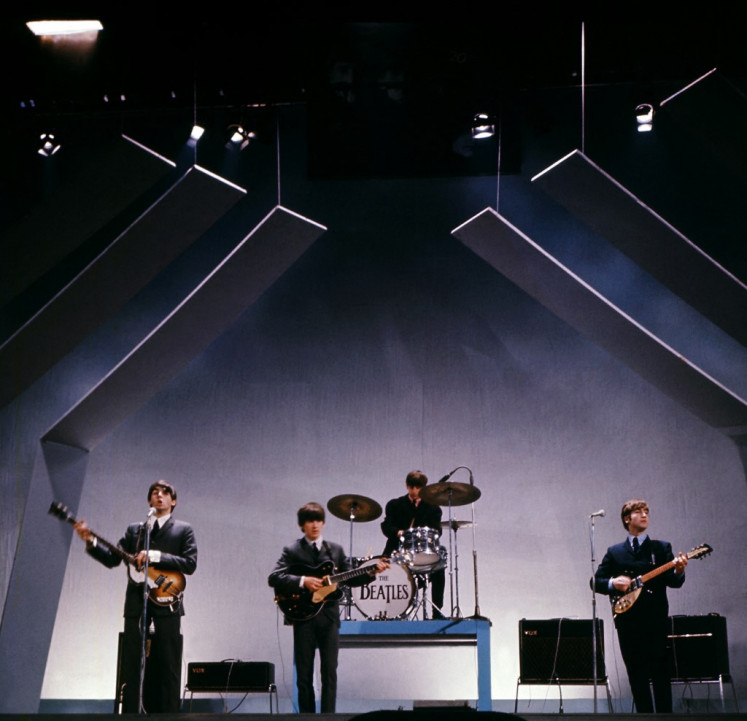 English band The Beatles (from left to right), Paul McCartney (bass), George Harrison (guitar), Ringo Starr (drums) et John Lennon (guitar) perform on stage during a concert, 29 July 1965, in London. “Let it Be“, the documentary film about The Beatles released just after the band's break up in 1970, hit screens again on May 8, 2024 -- the first time it has been legally available in over 50 years.