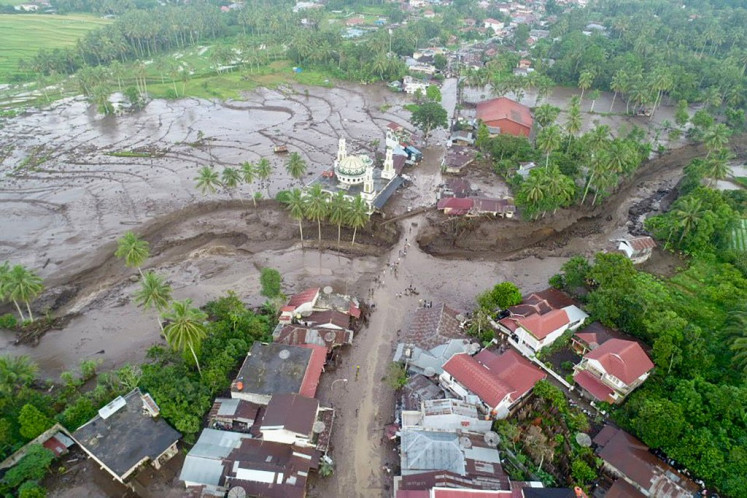 A neighborhood in Tanah Datar, West Sumatra, sits mired in mud and volcanic debris on May 12, 2024, after flooding and lahars struck the area. 