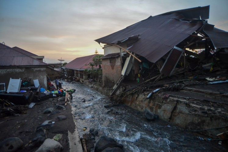 Houses destroyed by a weekend flood are seen on May 15, 2024, at
Jorong Galudua village in Agam, West Sumatra. At least 50 people died, and
dozens remain missing because of the disaster.
