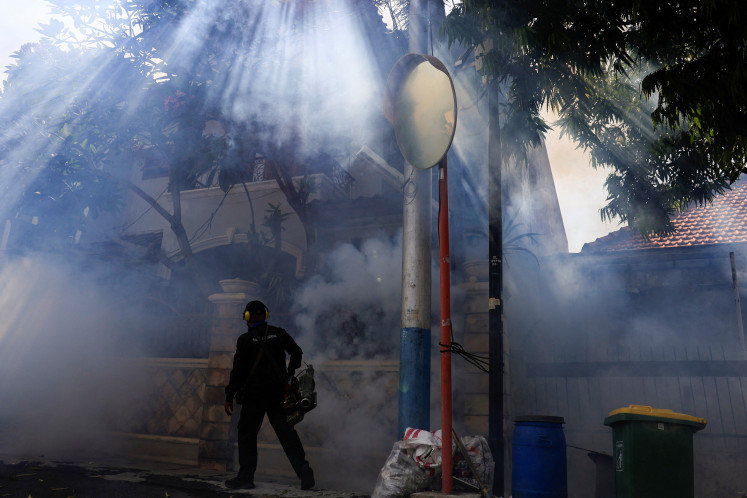 A health worker sprays pesticide on May 15, 2024, to prevent the spread of dengue in a residential area of Jakarta. The Jakarta administration is warning residents of a potential spike in dengue fever cases by the end of April.