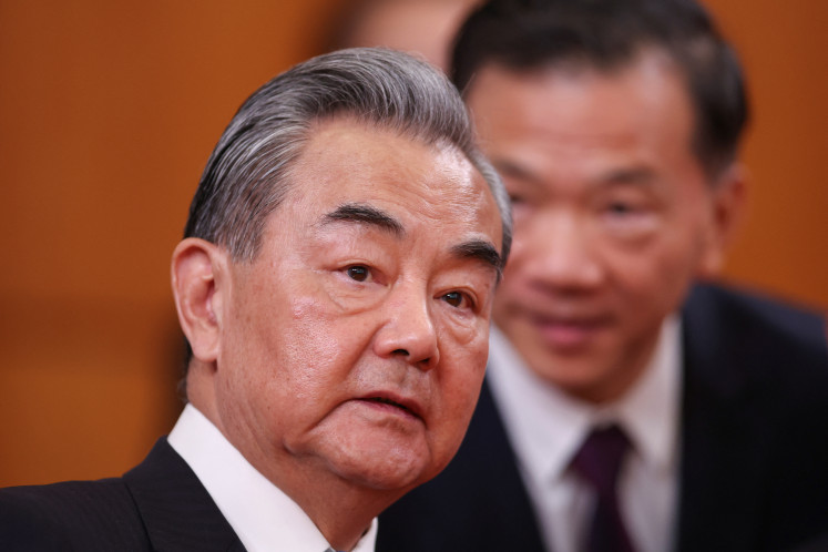 Chinese Foreign Minister Wang Yi looks on during a meeting of the Chinese and Serbian presidents at the Palace of Serbia in Belgrade on May 8, 2024.