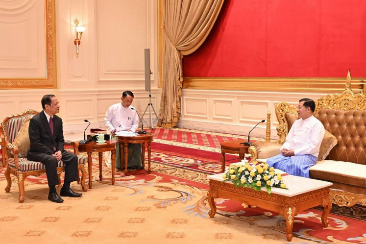 This handout photo taken and released on January 10, 2024 by the Myanmar Military Information Team shows Myanmar's military chief Min Aung Hlaing (right) meeting with Alounkeo Kittikhoun (left), special envoy of the ASEAN chair on Myanmar, in Naypyidaw. 