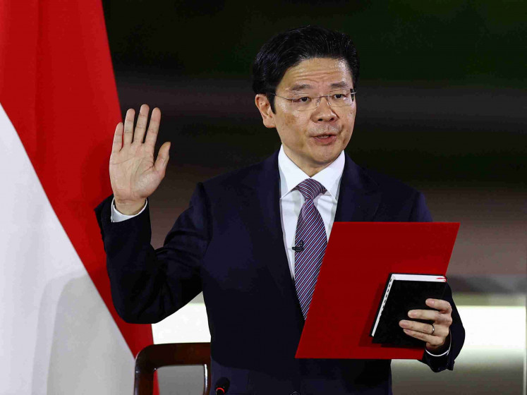 Singapore's Deputy Prime Minister Lawrence Wong is sworn in as Singapore's fourth Prime Minister at the Istana, in Singapore, May 15, 2024. 