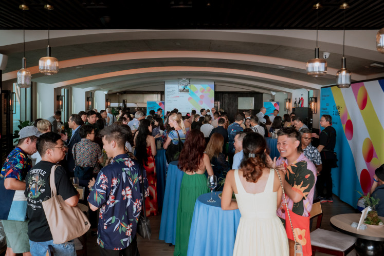 Local and international artists gather on Feb. 20, 2024, for the launch party of this year's Singapore International Festival of Arts (SIFA) at 1-Altitude Coast Bar in Singapore.