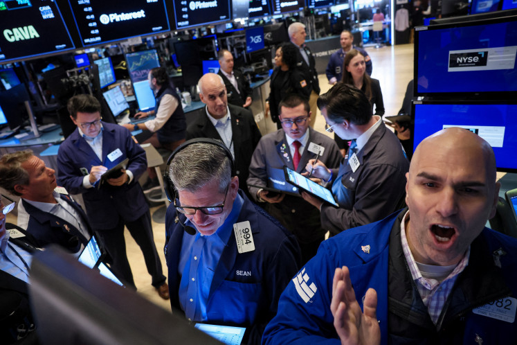 Traders work on the floor at the New York Stock Exchange (NYSE) in New York City, United States, on May 15, 2024.