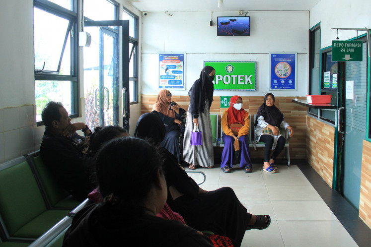 Patients line up to wait for medicine on May 14, 2024, from the pharmacy at Yarsi General Hospital in Pontianak, West Kalimantan.