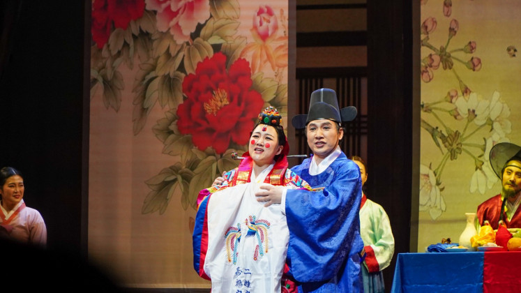 Destined love: Ippuni (left) and Mi-Eon embrace as their characters' story draws to an end during the South Korean opera “The Wedding Day“ on May 15, 2024, at Taman Ismail Marzuki in Central Jakarta.