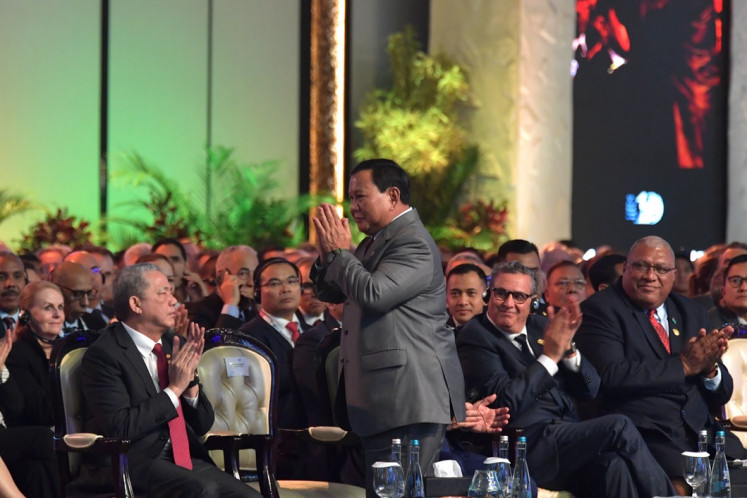 President-elect Prabowo Subianto, the incumbent defense minister, greets the audience on May 20, 2024 during the opening ceremony of the World Water Forum in Bali, shortly after President Joko “Jokowi” Widodo introduced him as his successor.