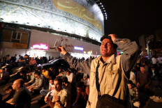 Iranians pray for President Ebrahim Raisi and Foreign Minister Hossein Amir-Abdollahian in Valiasr Square in central Tehran on May 19, 2024. A helicopter in the convoy Raisi and Amir-Abdollahian was involved in “an accident“ in East Azerbaijan province in poor weather conditions on May 19, state television reported. 