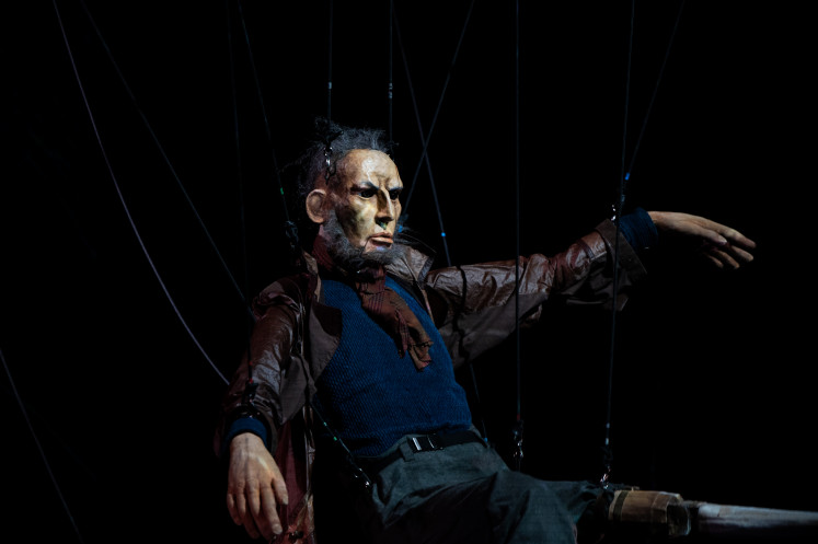 Master of the sea: A gigantic puppet of “Moby Dick” character Captain Ahab is held up by strings during a scene of a live theatrical adaptation of the classic work of literature by the French-Norwegian theater company Plexus Polaire at the Singapore International Festival of Arts (SIFA) on May 17, 2024.