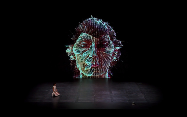 The face of technology: Spanish theater production “Una Isla” showcases artificial intelligence’s potential on the big screen during the 2024 Singapore International Festival of Arts (SIFA) at Singapore’s School of the Arts (SOTA) Drama Theatre on May 18, 2024.