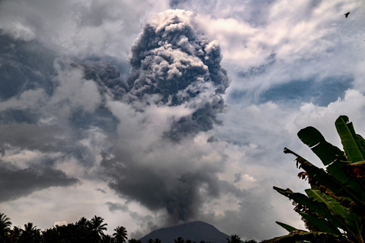 This handout picture taken and released on May 21, 2024 by the Geological Agency shows Mount Ibu spewing volcanic ash as seen from the monitoring post in West Halmahera, North Maluku. 