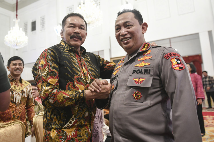Attorney General ST Burhanuddin (left) poses with National Police Chief Gen. Listyo Sigit Prabowo during an event at the Presidential Palace in Jakarta on May 27, 2024.