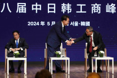Northeast Asian leaders (from left) Japanese Prime Minister Fumio Kishida, South Korean President Yoon Suk-yeol and Chinese Premier Li Qiang attend the 8th Trilateral Business Summit on May 27, 2024 at the Korea Chamber of Commerce and Industry in Seoul, held in conjunction with the 9th Republic of Korea-Japan-China Trilateral Summit. (Reuters/pool/Chung Sung-Jun)