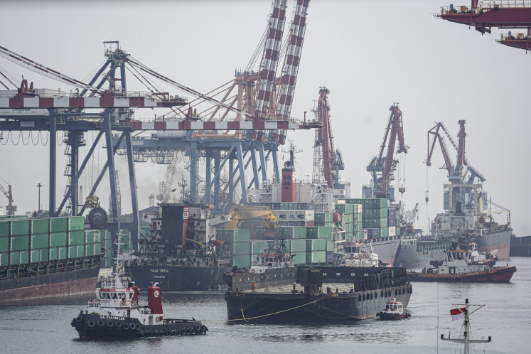 Various types of shipping vessels go about their activities on May 20, 2024, at a container terminal at Tanjung Priok Port in North Jakarta.
