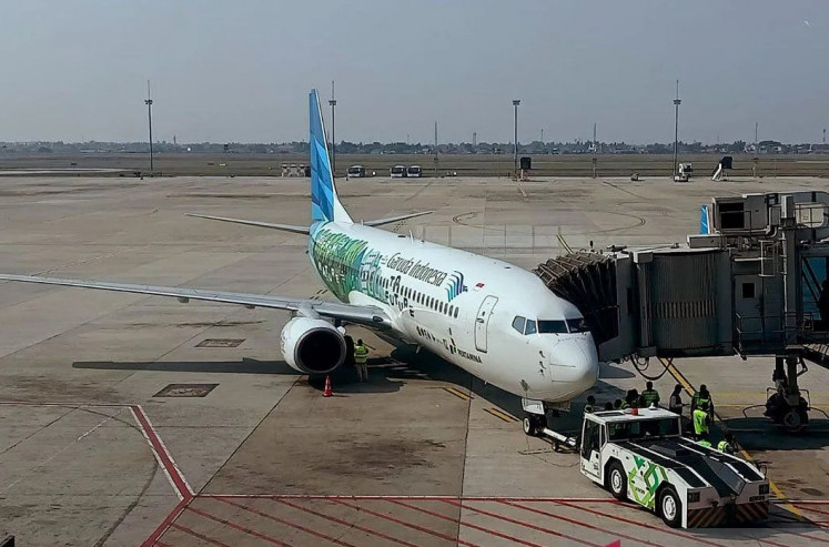 Green flight: Technicians prepare a Garuda Indonesia plane for a test flight using sustainable aviation fuel on Oct. 27, 2023, at Soekarno-Hatta International Airport in Tangerang, Banten. The plane successfully landed in Adi Sumarmo Airport in Surakarta, Central Java, later that day.

