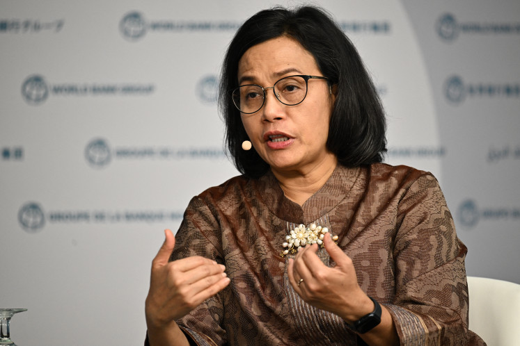 Finance Minister Sri Mulyani Indrawati speaks during an event about expanding
health coverage for all during the IMF-World Bank Group spring meetings at World Bank
headquarters in Washington, DC, on April 18, 2024.