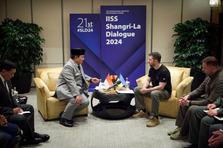 In this handout photograph taken and released by the Ukrainian Presidential Press Service on June 1, 2024, Ukraine's President Volodymyr Zelensky (right) attends a meeting with Defence Minister and president-elect Prabowo Subianto (right) during Shangri-La Dialogue Summit in Singapore. 