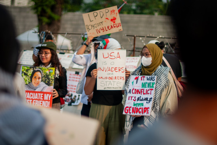 Protesters stage pro-Palestinian rallies on Friday, May 31, 2024, in front of the United States Embassy in Central Jakarta.
