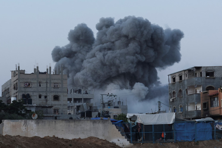 Smoke rises during an Israeli air strike in central Gaza Strip on June 3, 2024.
