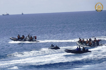 This handout photo taken on May 19, 2024 and received on June 4, 2024 from the Armed Forces of the Philippines shows two Chinese rigid-hulled inflatable boats (left and right) maneuvering close to Philippine personnel on board their boats (second left and right) near the Philippine outpost at Second Second Thomas Shoal in disputed waters of the South China Sea. The Philippine military said June 4 that Chinese boats illegally &ldquo;seized&ldquo; food and medicine airdropped to a Filipino outpost in the South China Sea. Chinese personnel on board the boats later dumped the items in the water, a Philippine Navy spokesman said.