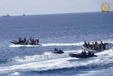 This handout photo taken on May 19, 2024 and received on June 4, 2024 from the Armed Forces of the Philippines shows two Chinese rigid-hulled inflatable boats (left and right) maneuvering close to Philippine personnel on board their boats (second left and right) near the Philippine outpost at Second Second Thomas Shoal in disputed waters of the South China Sea. 