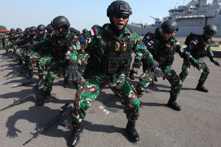 Marines perform chants during the departure ceremony of the Rim Of The Pacific Task Force in Surabaya, East Java, on May 31, 2024.