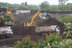 Heavy vehicles operate at a coal mine in Sumber Batu village, Meureubo district, West Aceh regency, Aceh, on May 24, 2024.