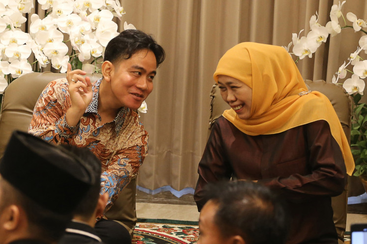 Vice president-elect Gibran Rakabuming Raka (left) speaks with Khofifah Indar Parawansa, the chair of Nahdlatul Ulama (NU) women's wing Muslimat NU and former East Java governor, during a visit to her residence in Surabaya, East Java, on June 6, 2024. During their meeting, Gibran expressed his support for Khofifah, who is seeking reelection in the upcoming East Java gubernatorial election.