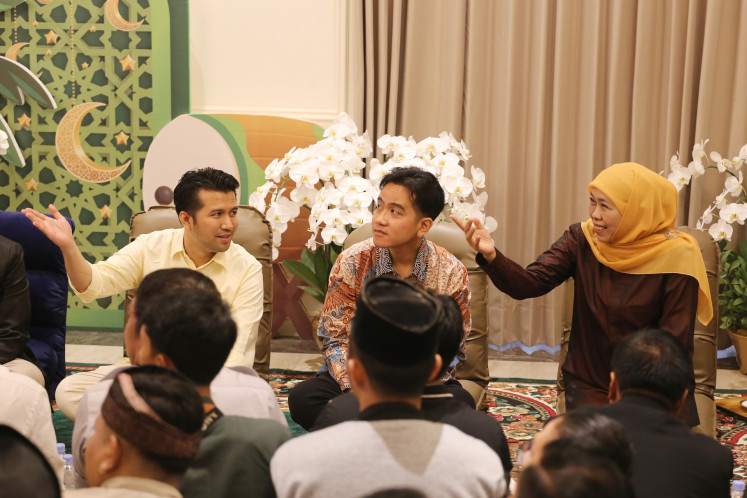 Vice president-elect Gibran Rakabuming Raka (center) listens on June 6, 2024 as Khofifah Indar Parawansa (right), former East Java governor and chair of Nahdlatul Ulama (NU) women's wing Muslimat NU, and former deputy governor Emil Dardak speak during a gathering at Khofifah’s residence in Surabaya, East Java. Gibran has pledged to support Khofifah and Emil’s reelection bid in November.