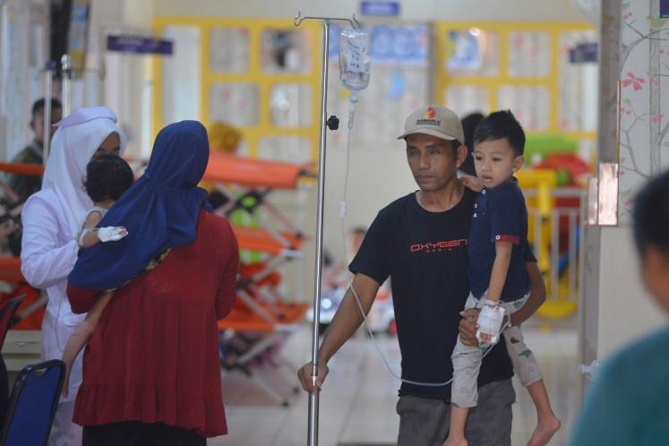 A father takes his child, who is hospitalized for diarrhea, for a walk around the children's ward of the Dr. Muhammad Zein Painan regional general hospital in South Pesisir regency, West Sumatra, on May 9, 2024.