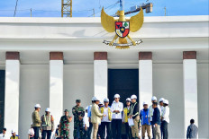 President Joko “Jokowi“ Widodo (center) inspects the venue to be used for the celebration of Indonesia's 79th Independence Day in the future capital city of Nusantara in Penajam Paser Utara, East Kalimantan, on June 5, 2024.