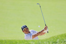 Hideki Matsuyama of Japan plays a shot from a bunker on the 18th hole on June 6 during the first round of the Memorial Tournament presented by Workday 2024 at Muirfield Village Golf Club in Dublin, Ohio, the United States.