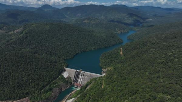 Shared power: The forested highlands of South Sulawesi&rsquo;s East Luwu regency tower over the Balambano hydropower plant in Wasuponda village on July 29, 2023. Built to support the operations of nickel producer PT Vale Indonesia, the power plant generates 110 megawatts, of which 10 MW are distributed to the surrounding community. 