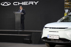 Chery International executive vice president Zhang Guibing delivers a speech after signing a joint venture agreement with Spanish group Ebro-EV Motors in Barcelona on April 19, 2024. Chinese carmaker Chery officialized that day its arrival in Spain, where it will produce locally-branded electric vehicles by the end of 2024. This move is another indication of Beijing's ambitions in the European market, amid an ongoing standoff with Brussels.