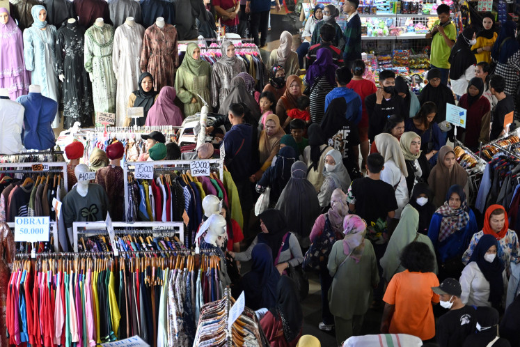 People shop for Idul Fitri celebration at the Tanah Abang textile market in
Jakarta on April 3, 2024. The Industrial Confidence Index has revealed that textiles and textile
products (TPT) have performed well over the last two months. The TPT industry outperformed
expectations with year-on-year (yoy) growth of 2.64 percent, but the industry’s export value
rose only 0.19 percent yoy to US$2.95 billion in the first quarter of 2024.