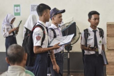 Aiming high: Junior high school graduates enroll on June 3, 2024, at the SMK 1 state vocational school in Ciamis, West Java.

