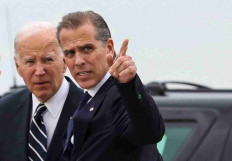 US President Joe Biden (left) stands with his son Hunter Biden, who earlier in the day was found guilty on all three counts in his criminal gun charges trial, after President Biden arrived at the Delaware Air National Guard Base in New Castle, Delaware, US, June 11, 2024.