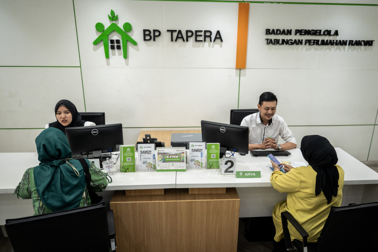 Customer service officers speak to participants of the Public Housing Savings (Tapera) program on May 30, 2024 at the BP Tapera office in Kebayoran Baru, South Jakarta.