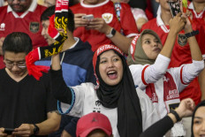 Indonesian fans cheer during the 2026 FIFA World Cup Asian qualification football match between Indonesia and Philippines at Gelora Bung Karno stadium in Jakarta on June 11, 2024. 